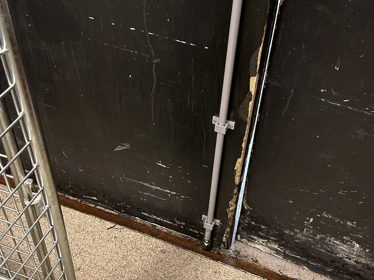 Professional locksmith tools beside a door lock
